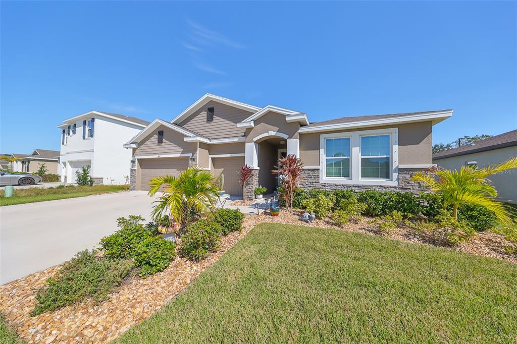 497 Spotted Slipper Place Ruskin, FL 33570 - Photo 1 of 1 a front view of a house with a yard