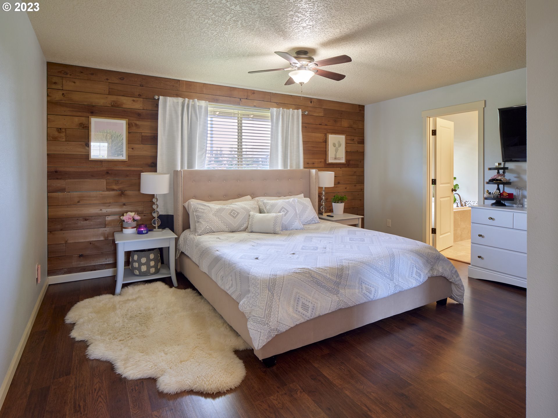 3551 North 1st Street Ridgefield, WA 98642 - Photo 20 of 38 a bedroom with a bed and wooden floor