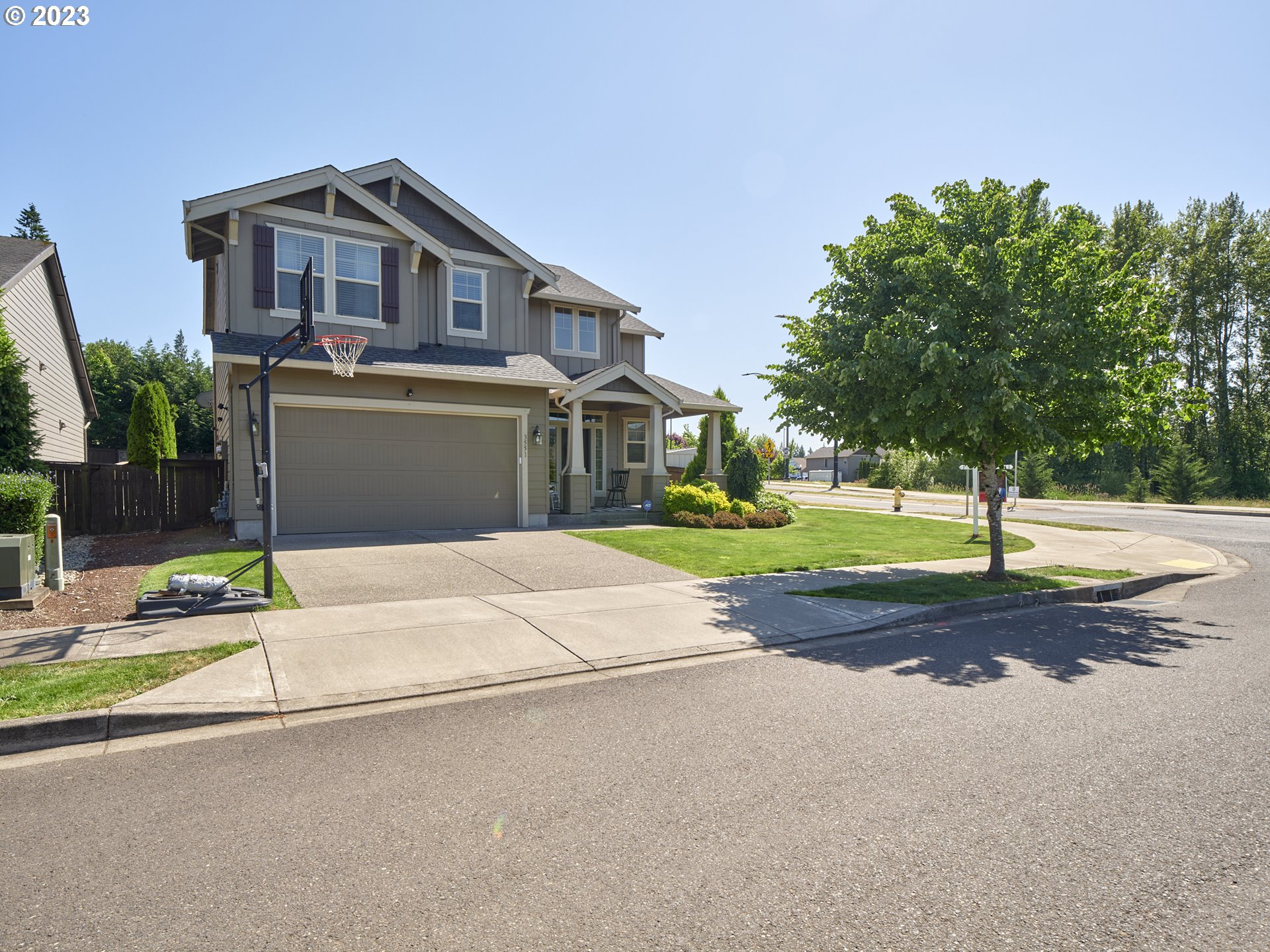 3551 North 1st Street Ridgefield, WA 98642 - Photo 2 of 38 a front view of a house with a yard and garage