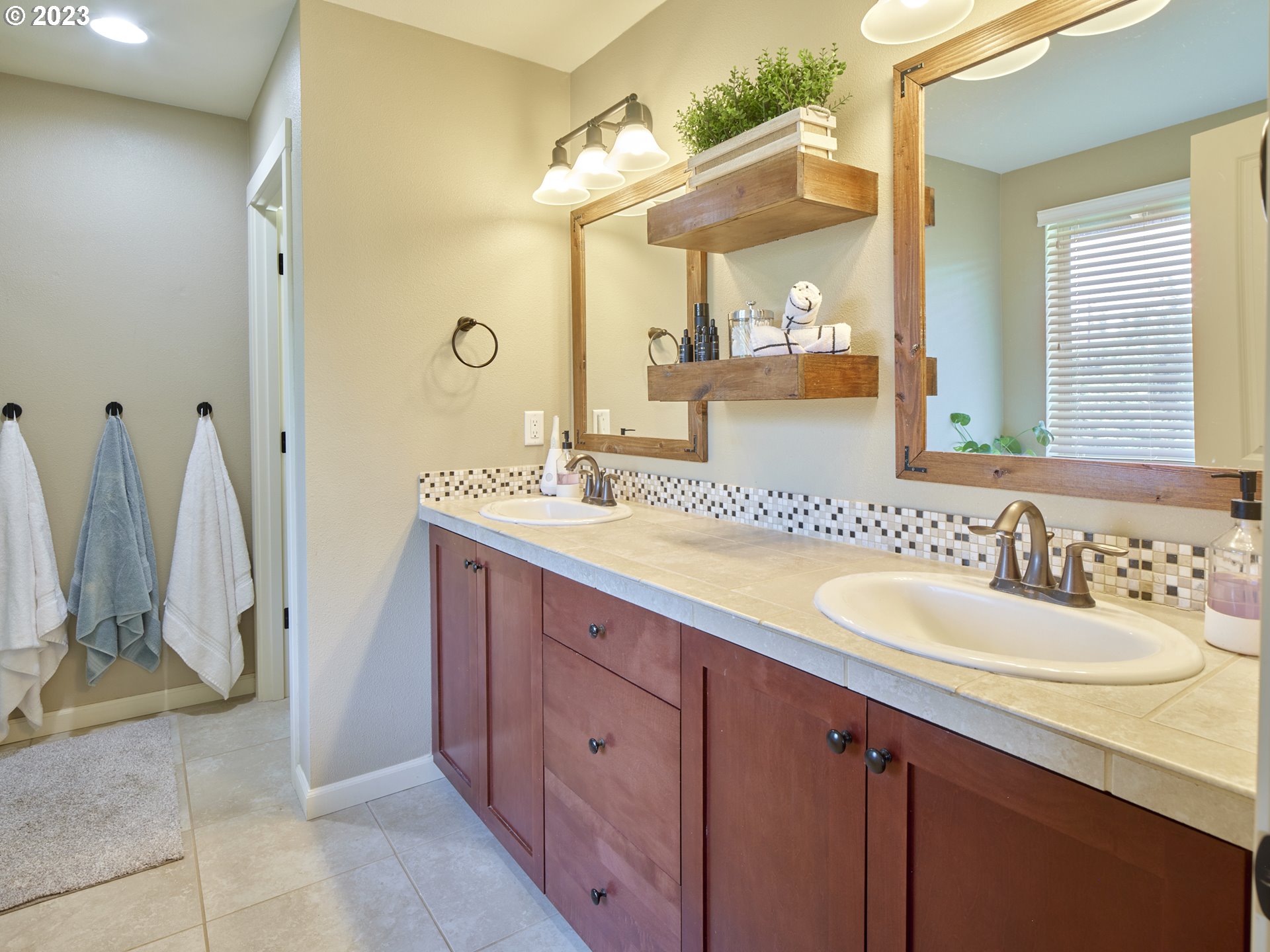 3551 North 1st Street Ridgefield, WA 98642 - Photo 22 of 38 a bathroom with a granite countertop sink and a mirror