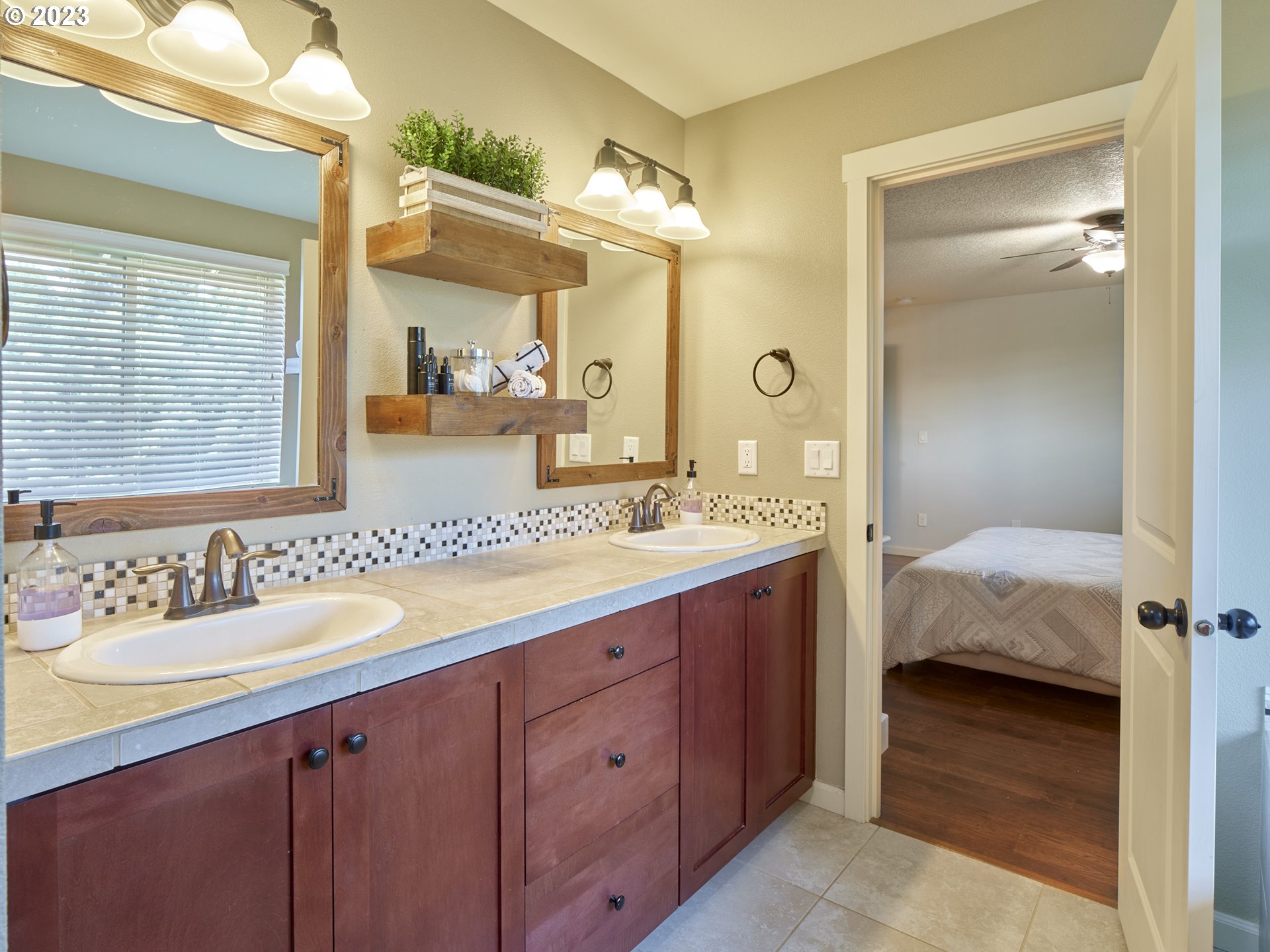 3551 North 1st Street Ridgefield, WA 98642 - Photo 24 of 38 a en suite bathroom with a double vanity sink and a mirror