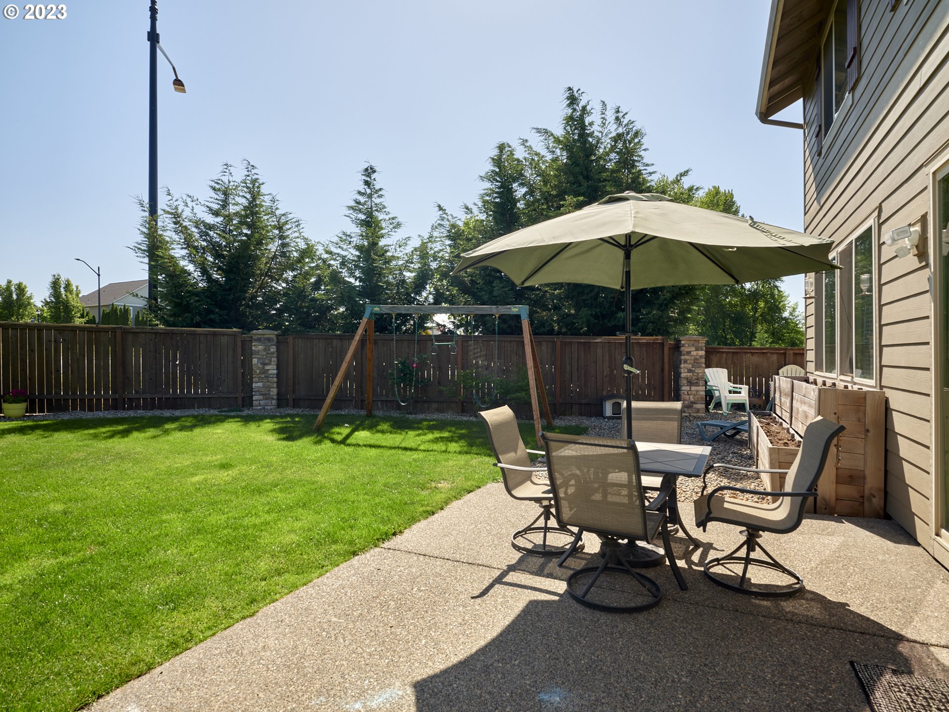 3551 North 1st Street Ridgefield, WA 98642 - Photo 27 of 38 a view of backyard with seating space and wooden fence