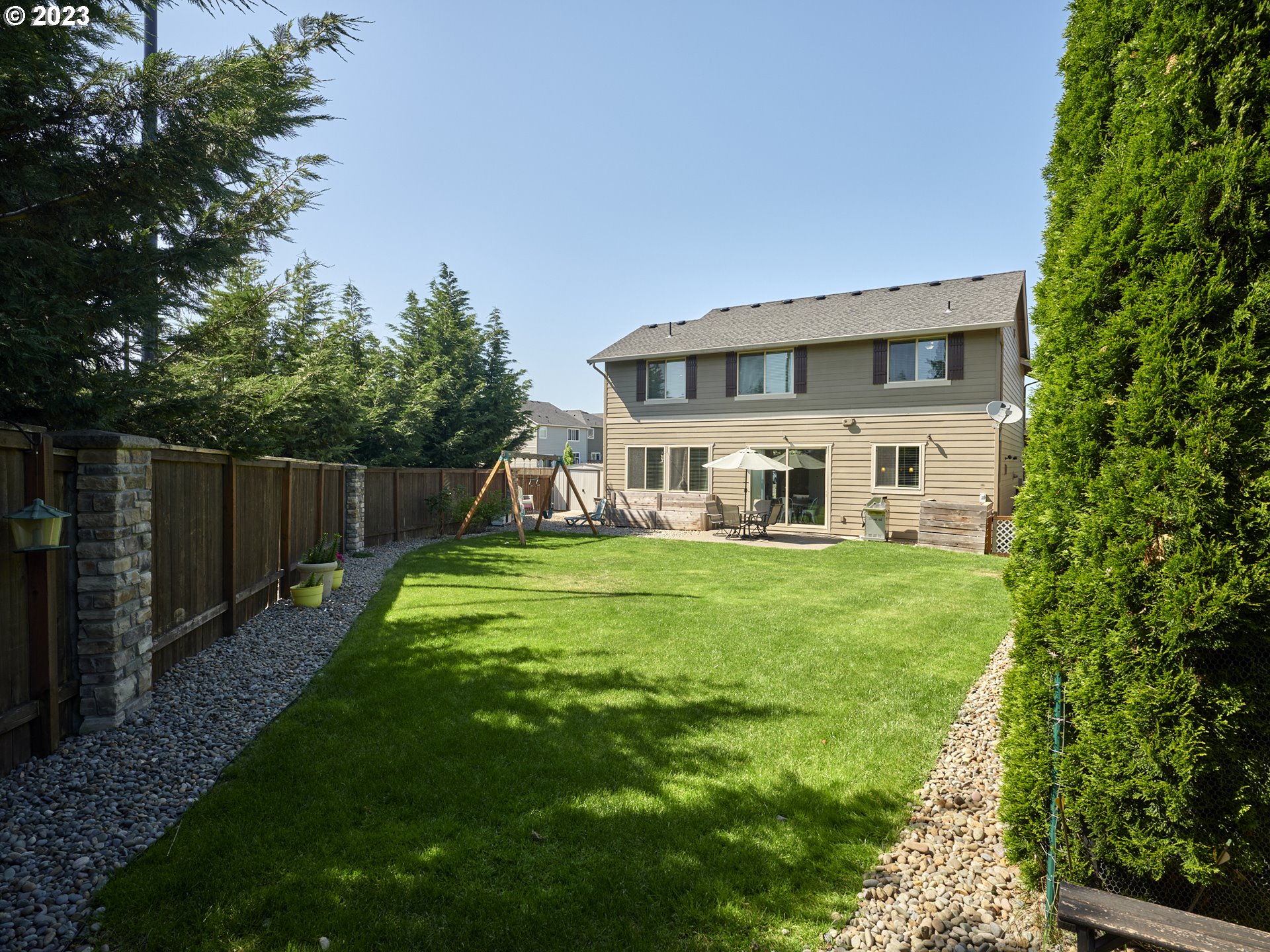 3551 North 1st Street Ridgefield, WA 98642 - Photo 29 of 38 a front view of a house with a yard table and chairs