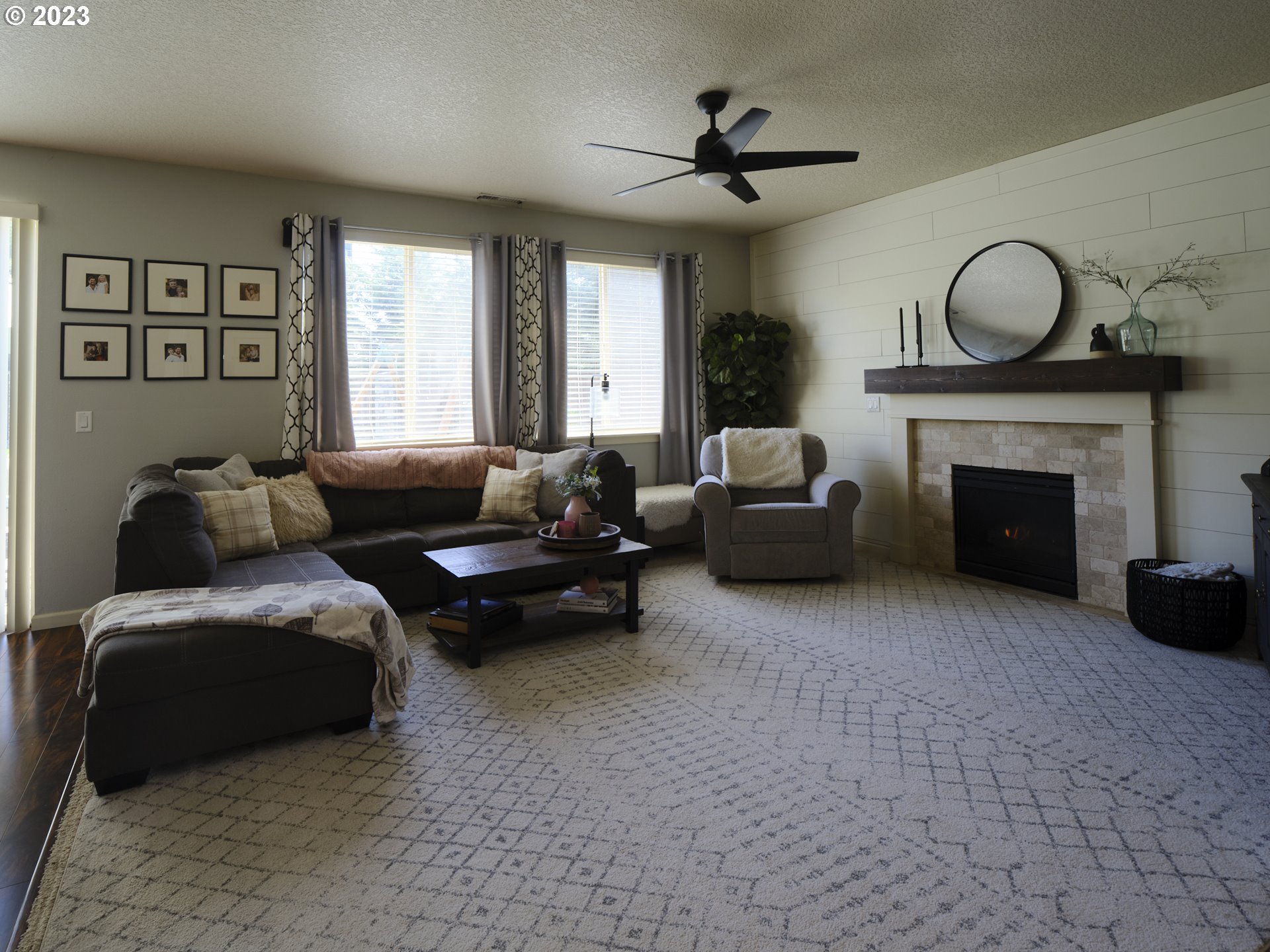 3551 North 1st Street Ridgefield, WA 98642 - Photo 6 of 38 a living room with furniture and a fireplace