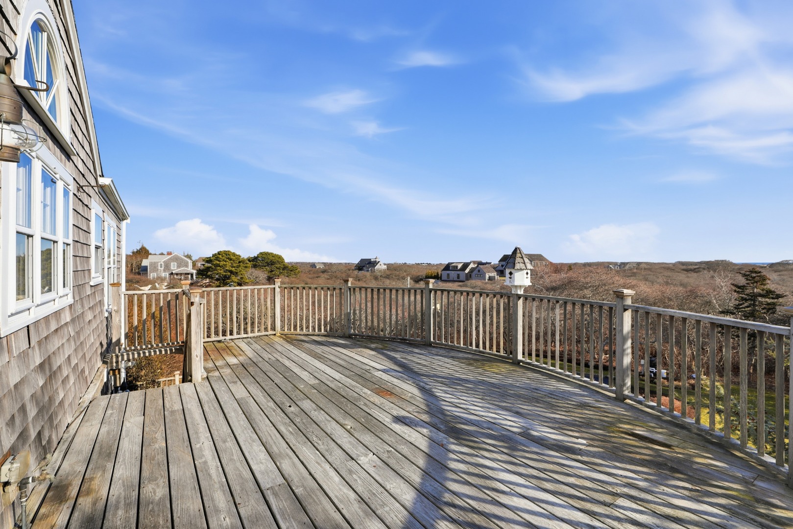 31 Flintlock Road Nantucket, MA 02554 - Photo 9 of 23 a view of a roof with wooden floor and fence