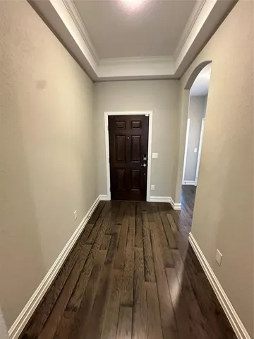 a view of a room with wooden floor and staircase