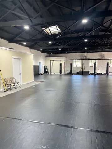 a view of a studio with wooden floor