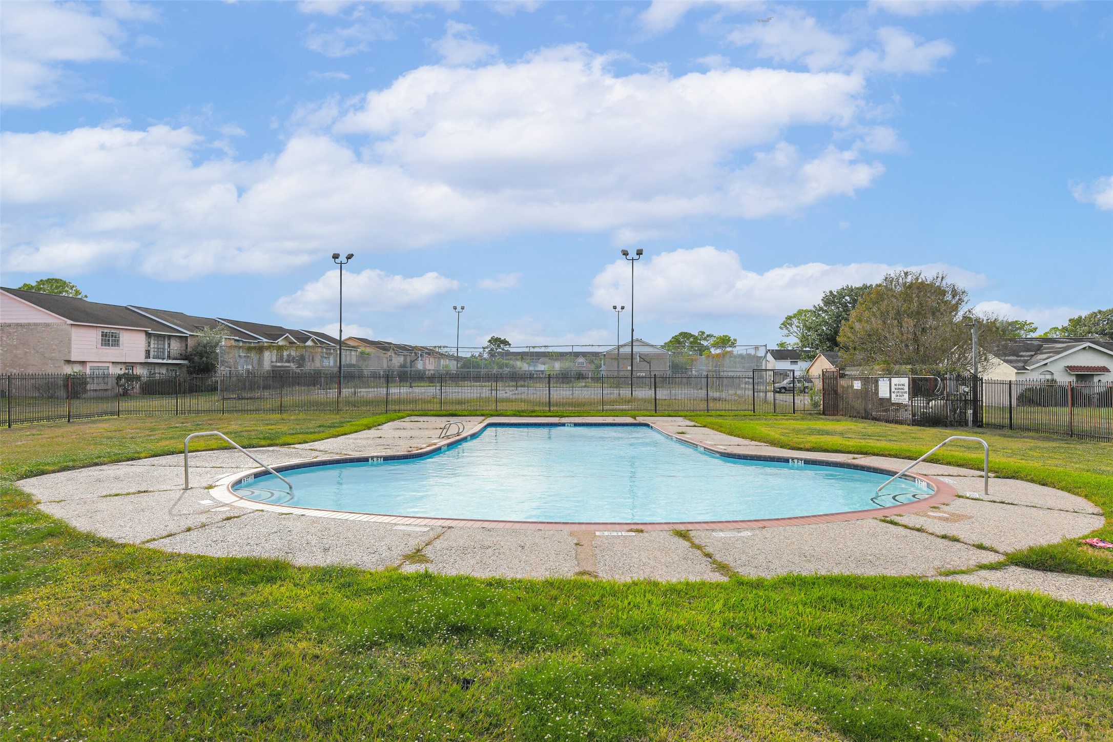 6853 Chasewood Drive Houston, TX 77489 - Photo 29 of 29 a view of a swimming pool and a yard