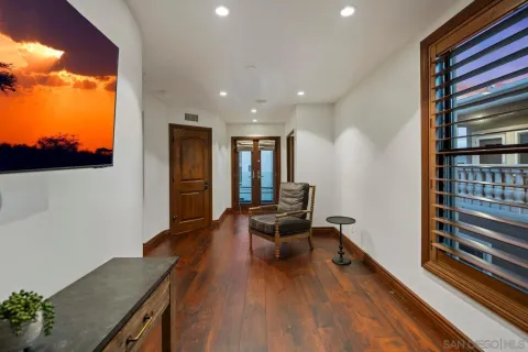 a living room with furniture and a book shelf