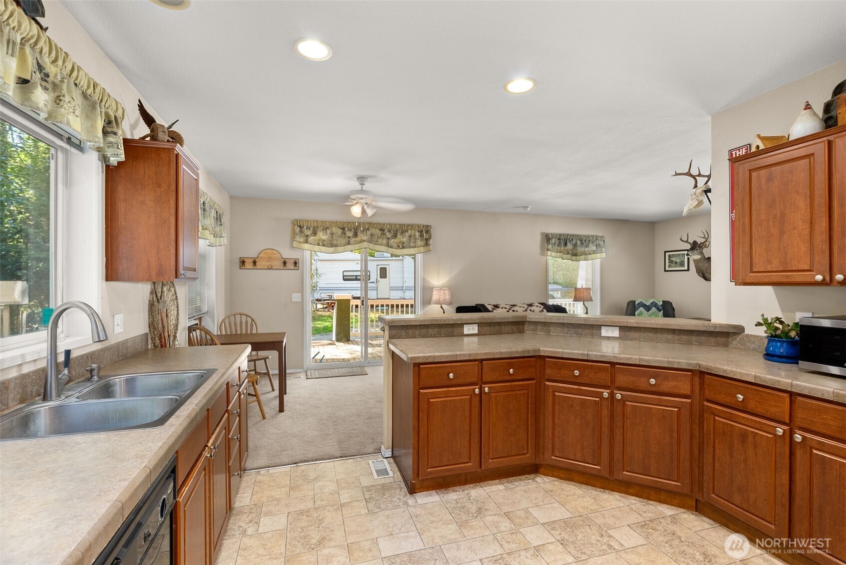 22010 Summers Road Centralia, WA 98531 - Photo 11 of 33 a kitchen with a sink stove and cabinets