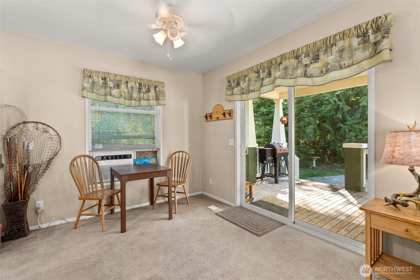 22010 Summers Road Centralia, WA 98531 - Photo 12 of 33 a view of a dining room with furniture a chandelier and a large window