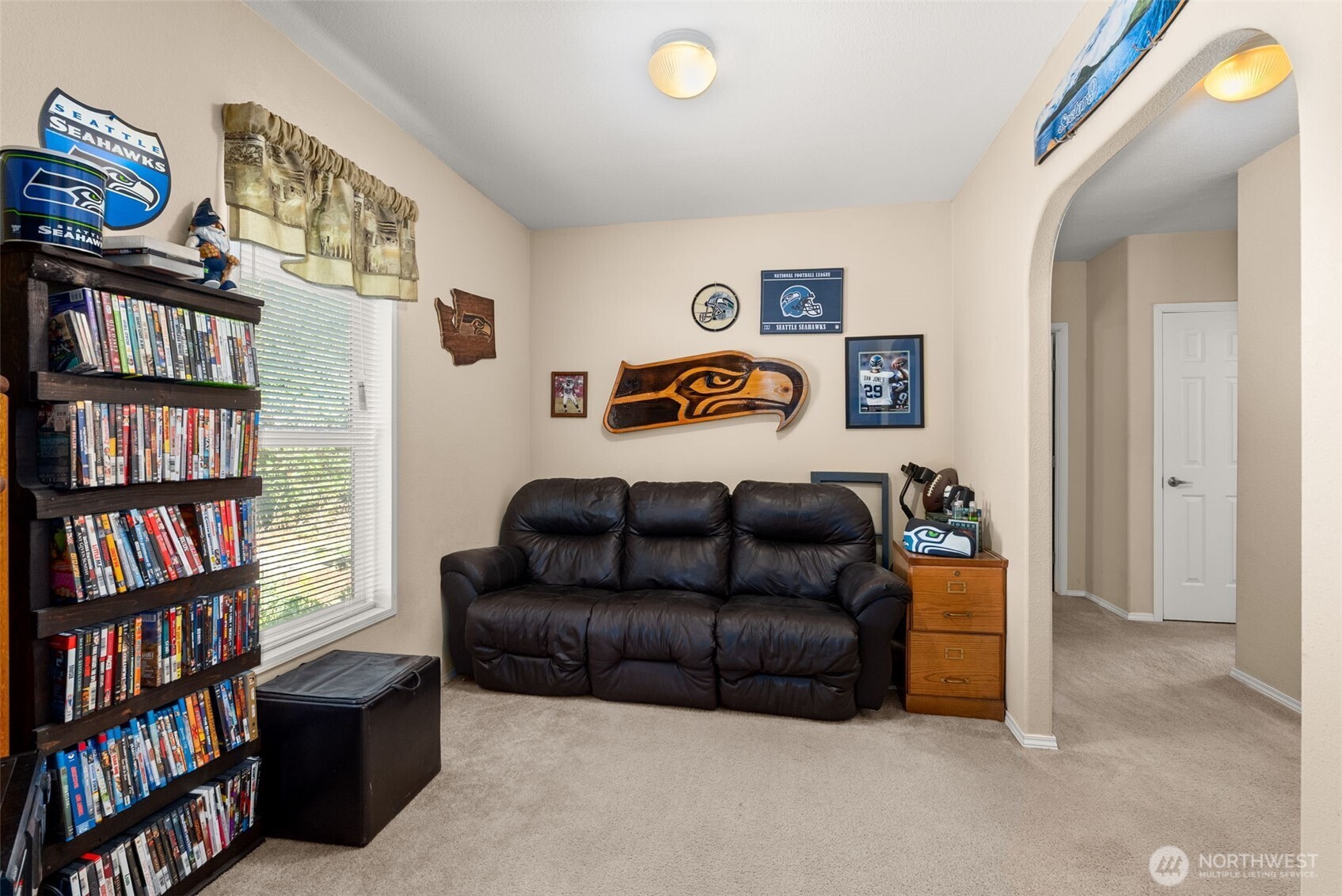 22010 Summers Road Centralia, WA 98531 - Photo 13 of 33 a living room with couch and a book shelf