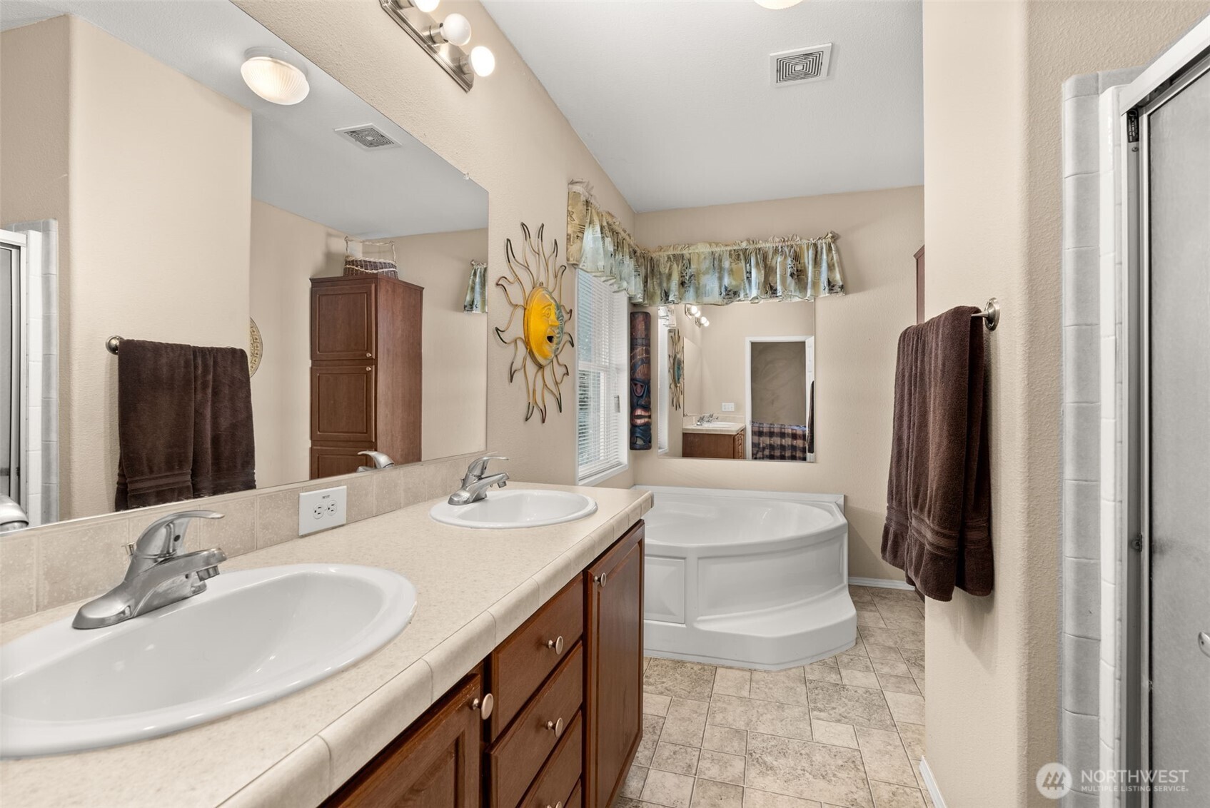 22010 Summers Road Centralia, WA 98531 - Photo 17 of 33 a bathroom with double vanity sink and a mirror