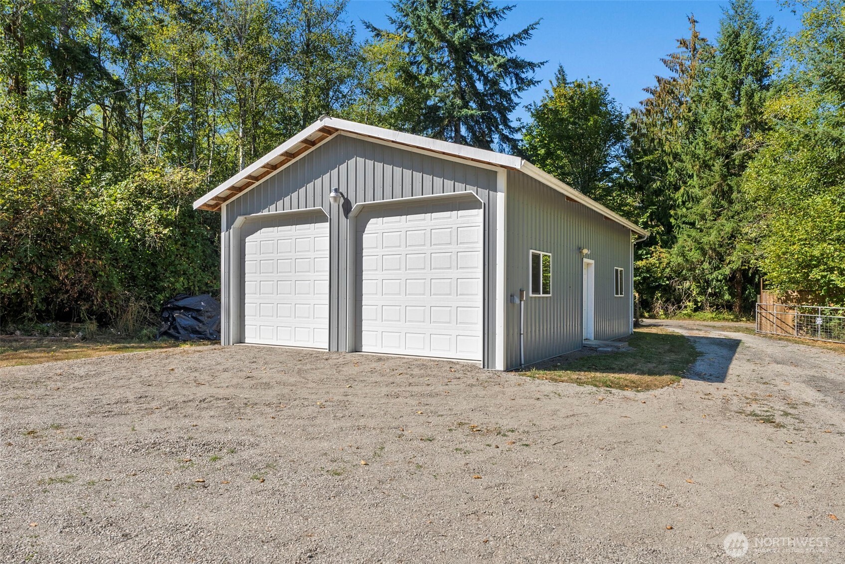22010 Summers Road Centralia, WA 98531 - Photo 3 of 33 a front view of a house with a yard and garage