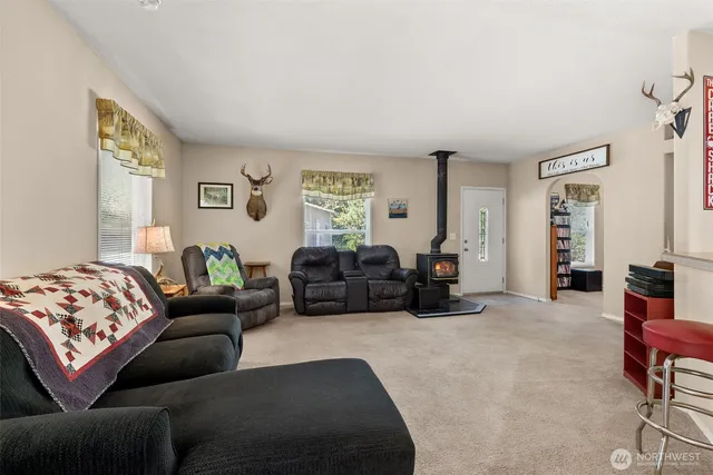 a living room with furniture window and couch