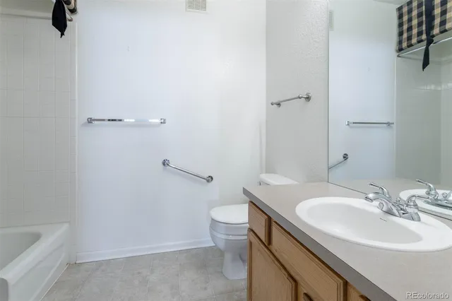 a bathroom with a sink toilet and a tub