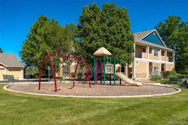 a view of a park with swings