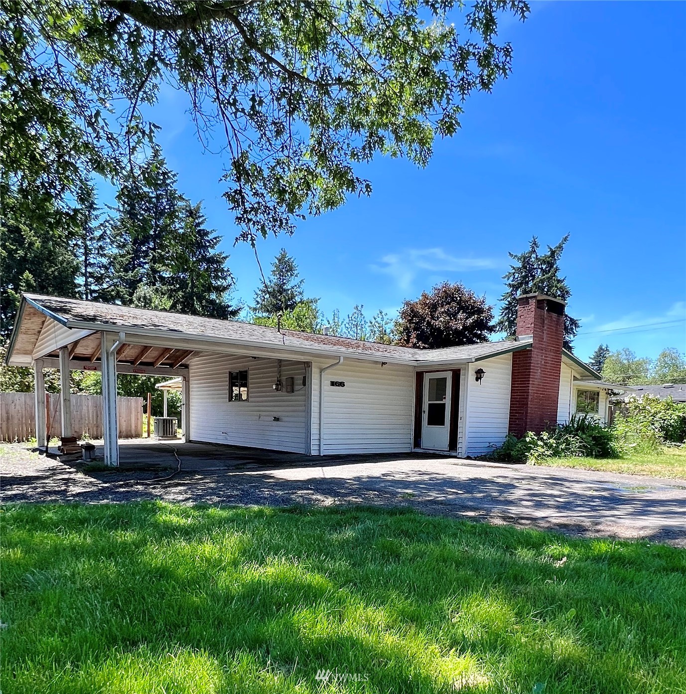 1166 Brookdale Road East Tacoma, WA 98445 - Photo 1 of 20 a front view of house with yard and trees