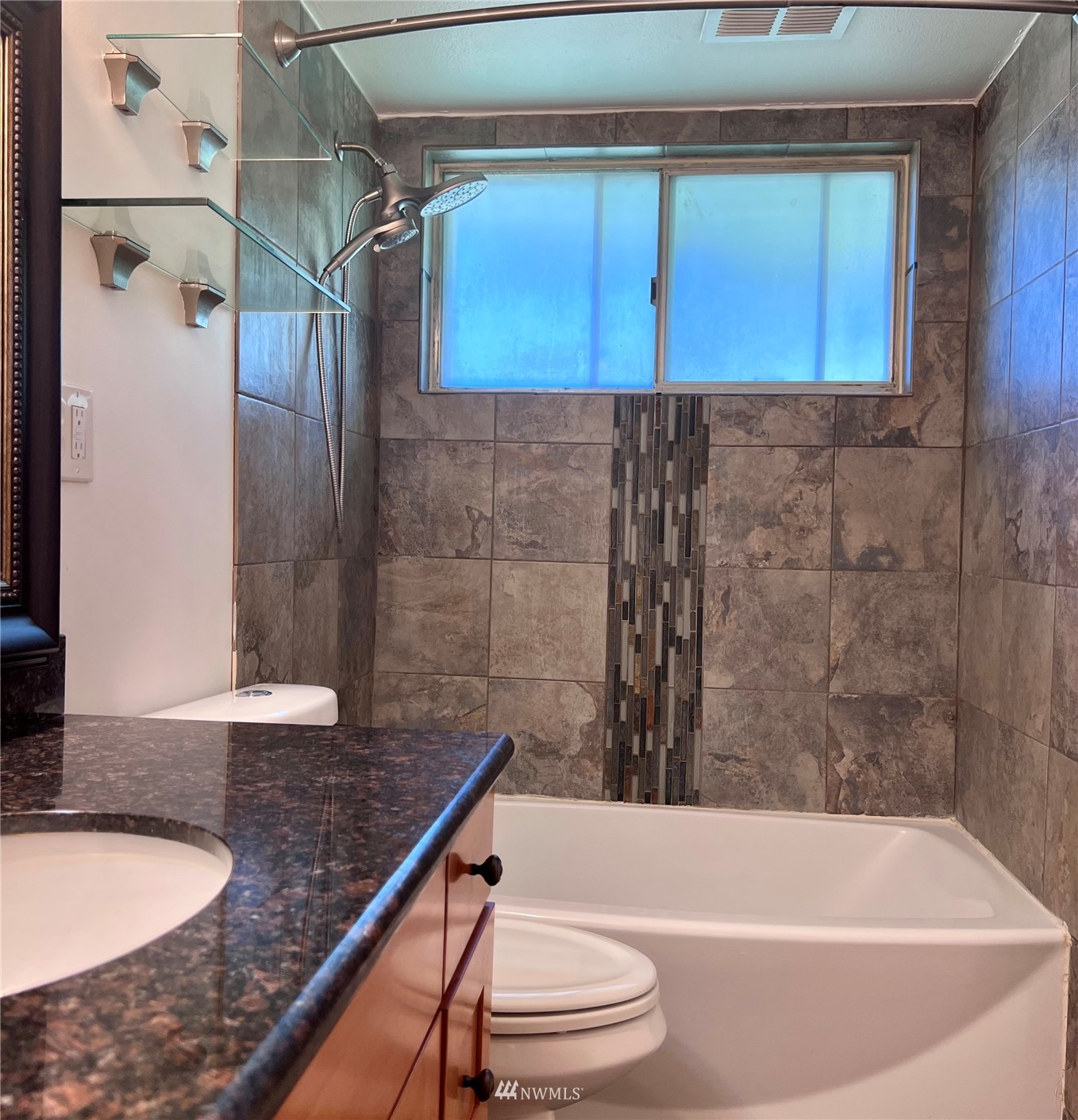 1166 Brookdale Road East Tacoma, WA 98445 - Photo 11 of 20 a bathroom with a granite countertop bathtub shower and toilet