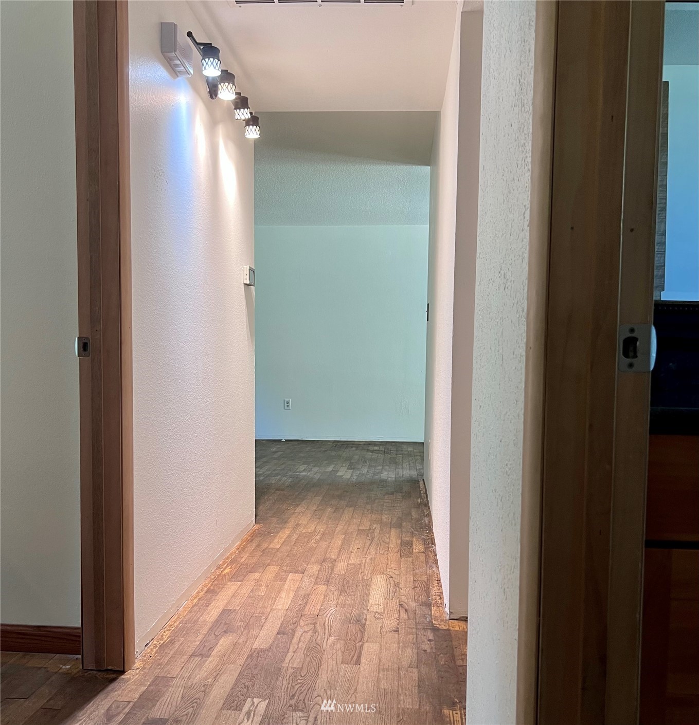 1166 Brookdale Road East Tacoma, WA 98445 - Photo 13 of 20 a view of a room with wooden floor