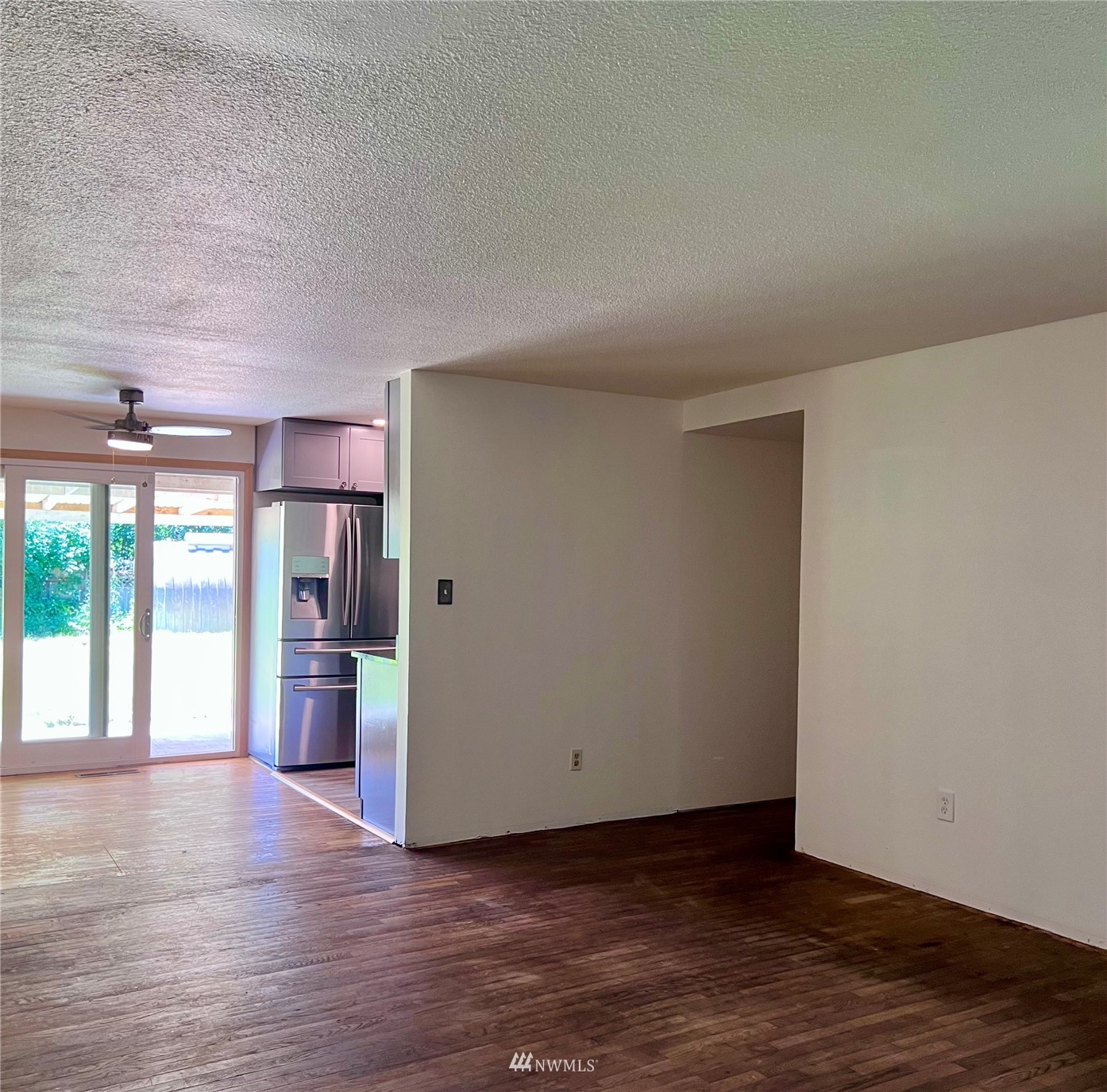 1166 Brookdale Road East Tacoma, WA 98445 - Photo 4 of 20 a view of an empty room with a window