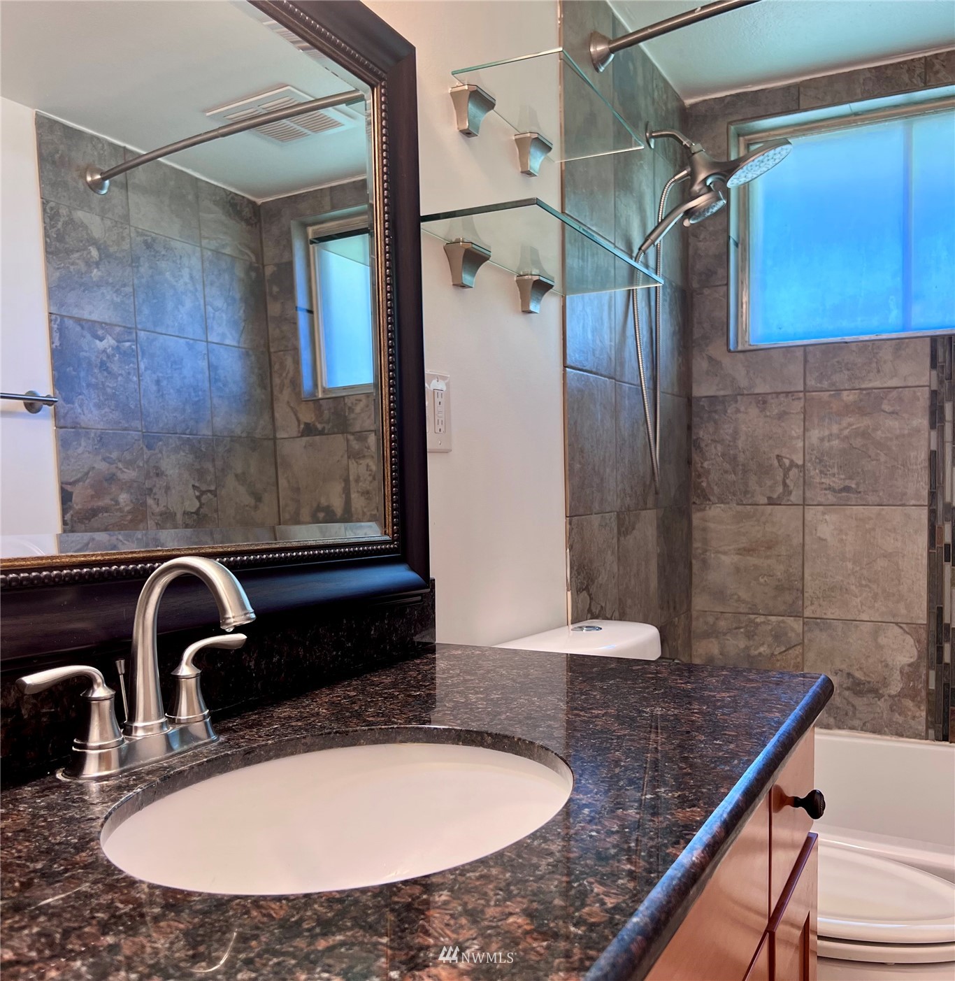 1166 Brookdale Road East Tacoma, WA 98445 - Photo 10 of 20 a bathroom with a sink and a mirror