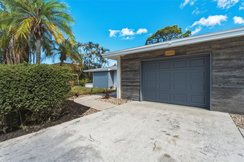 1330 Horizon Road Venice, FL 34293 - Photo 3 of 40 a front view of a house with a yard and garage
