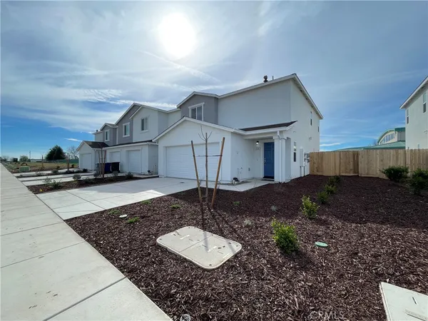 a house view with a backyard space
