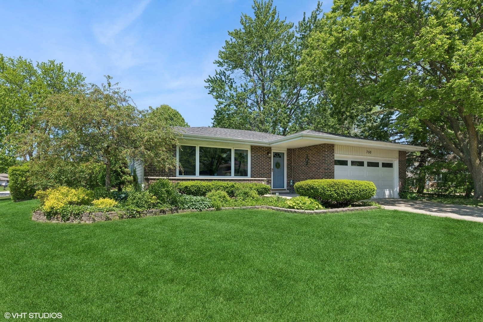 a view of house with backyard