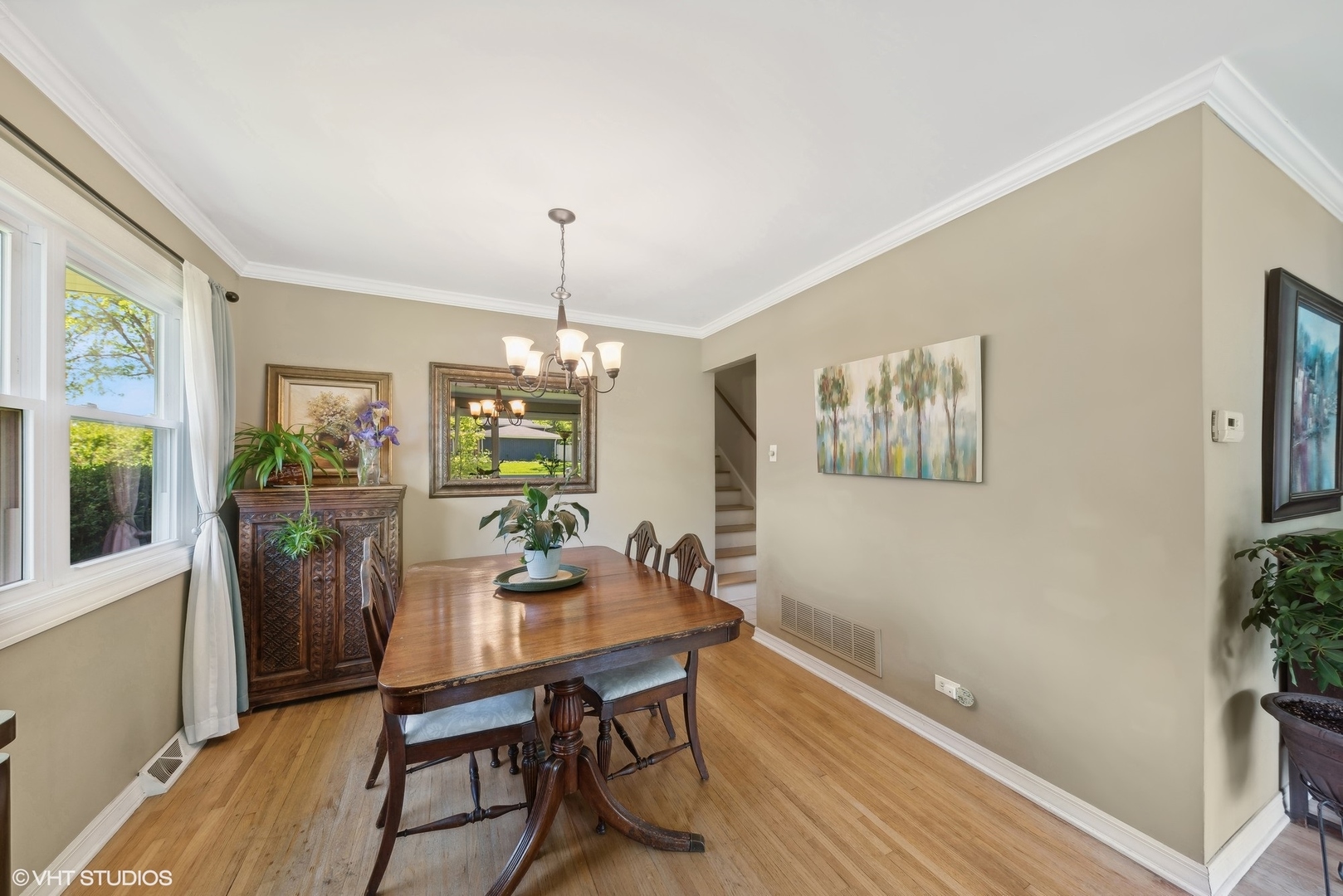 750 Leaf Court Bartlett, IL 60103 - Photo 5 of 17 a view of a dining room with furniture window and wooden floor