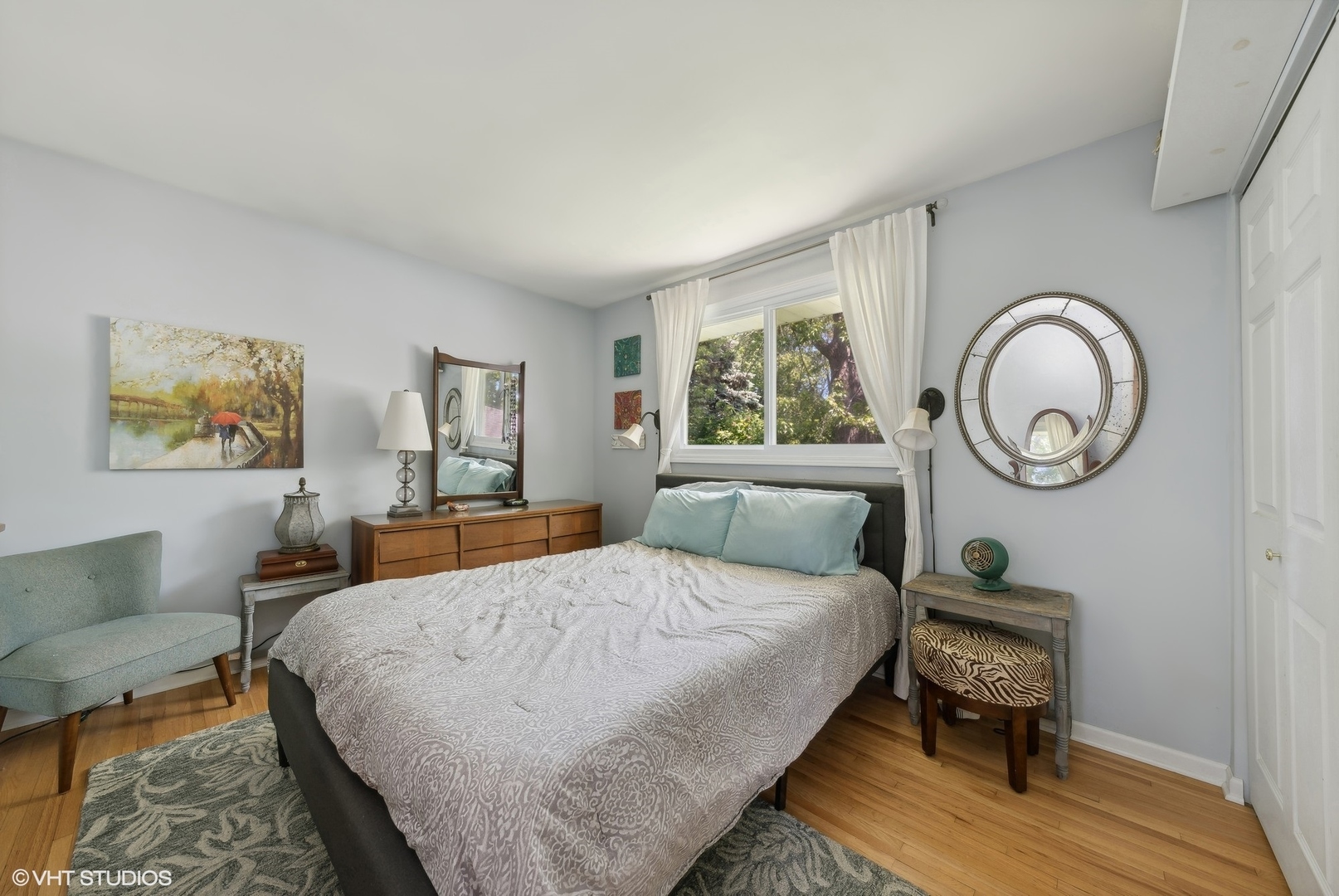 750 Leaf Court Bartlett, IL 60103 - Photo 7 of 17 a bedroom with a bed a mirror and a window