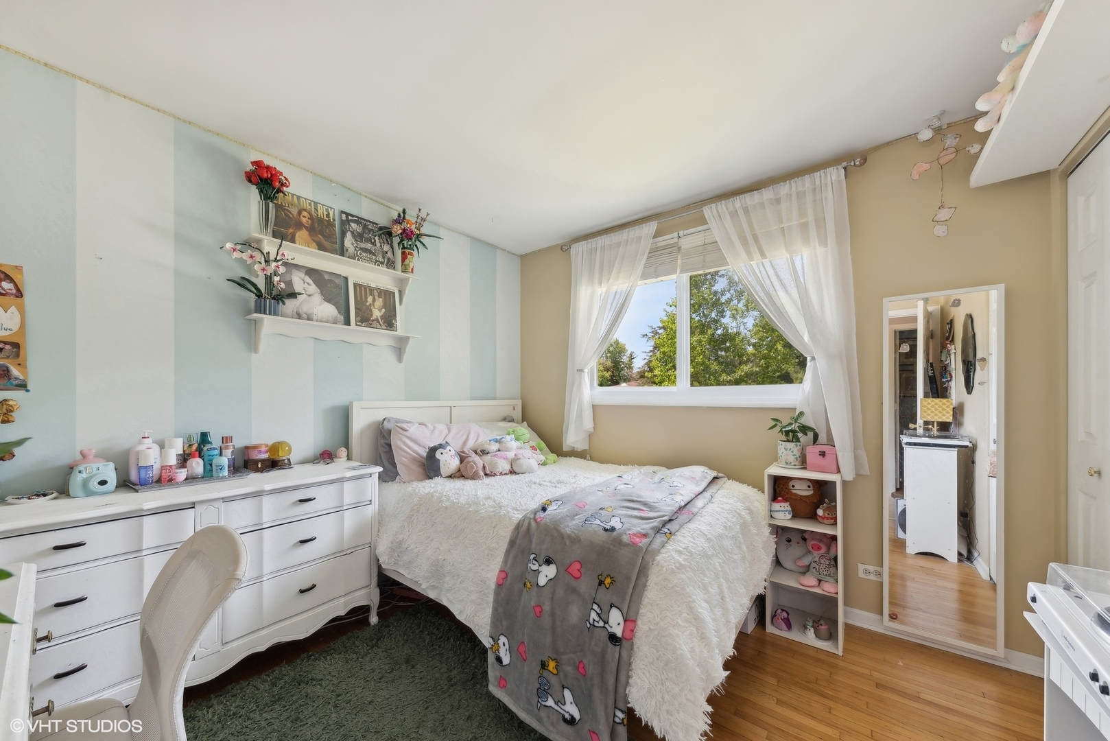 750 Leaf Court Bartlett, IL 60103 - Photo 9 of 17 a bedroom with a bed and wooden floor