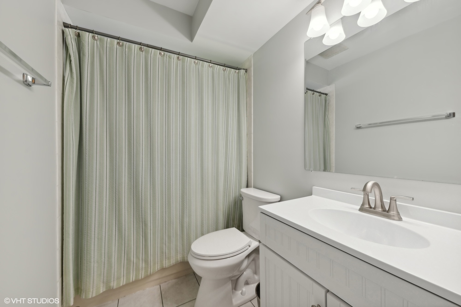 750 Leaf Court Bartlett, IL 60103 - Photo 10 of 17 a bathroom with a sink a toilet and shower