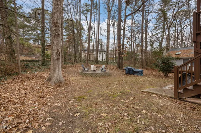 a vase of flowers sitting on a floor