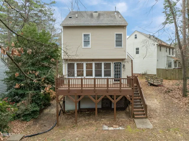 an aerial view of a house with outdoor space