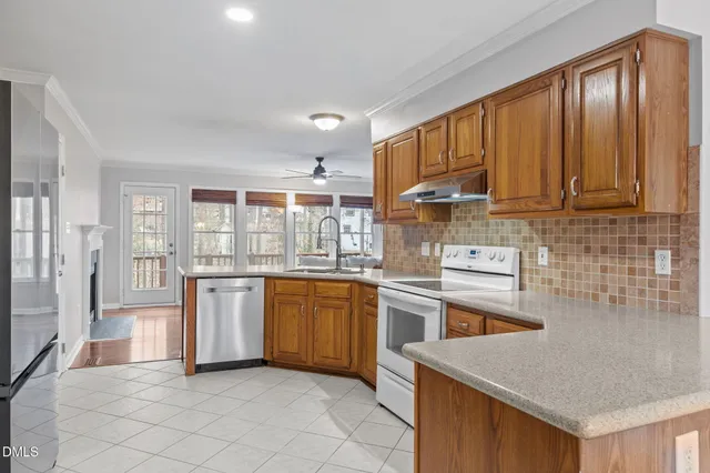 a kitchen with granite countertop cabinets and stainless steel appliances