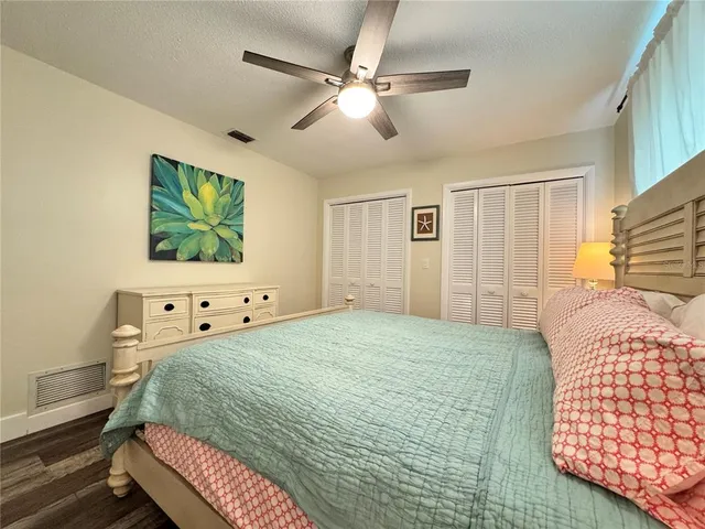 a bathroom with a double vanity sink and a toilet