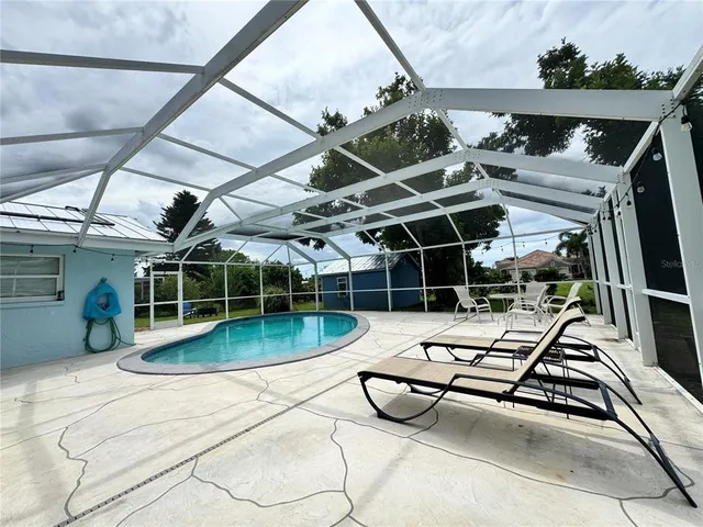 a outdoor space with swimming pool and furniture