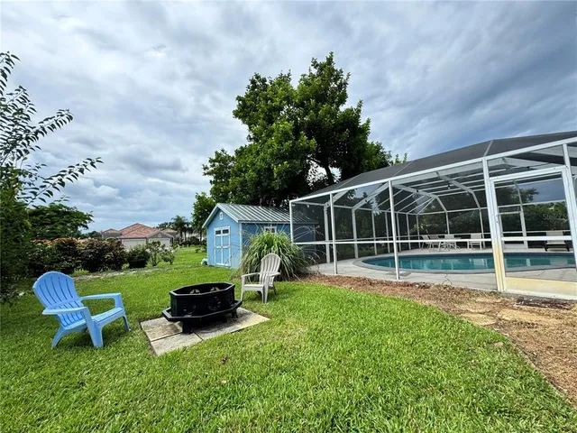 a view of a chair and table in the garden