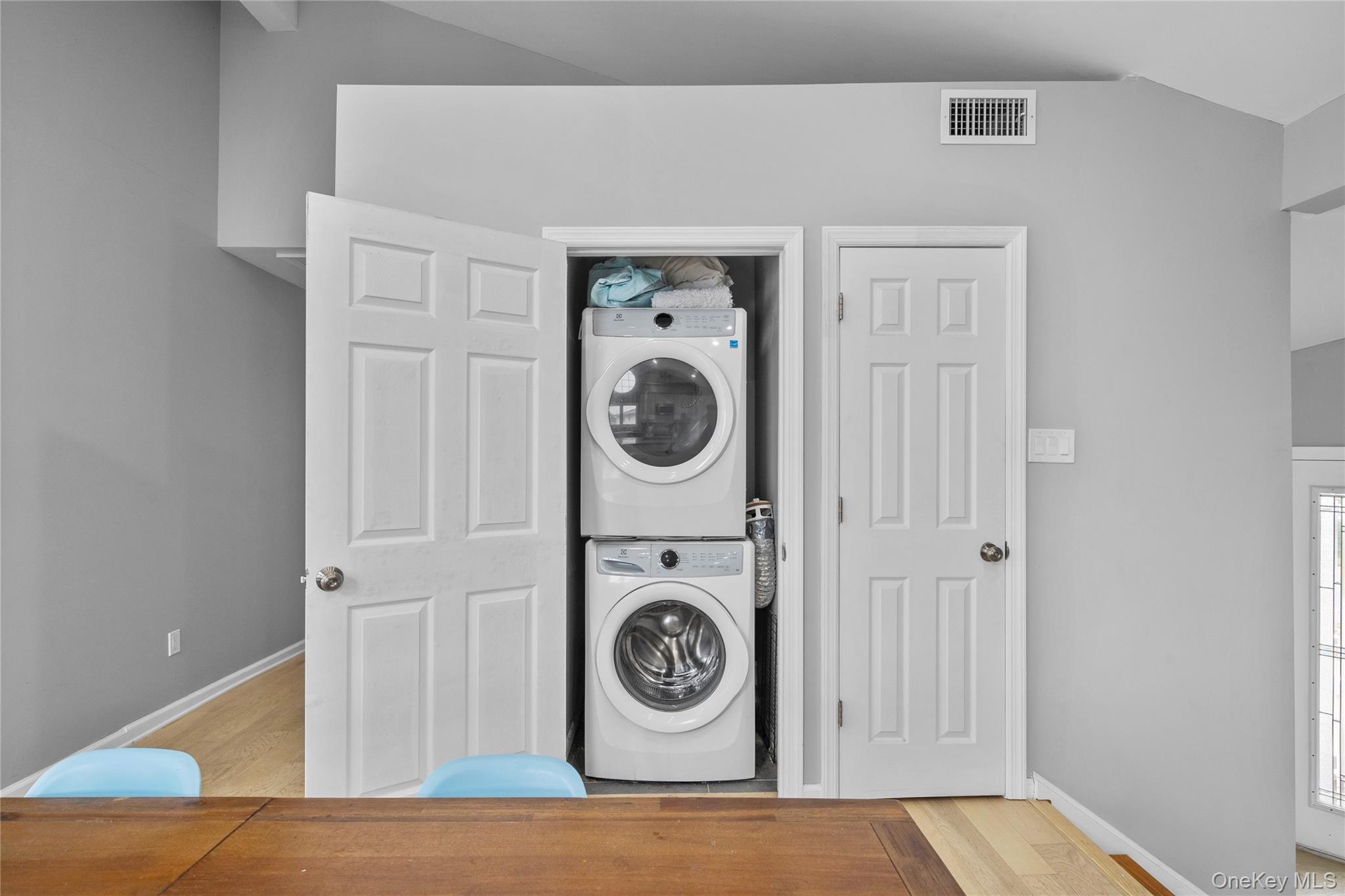 Undisclosed Address Freeport, NY 11520 - Photo 19 of 22 a view of a hallway with washer and dryer
