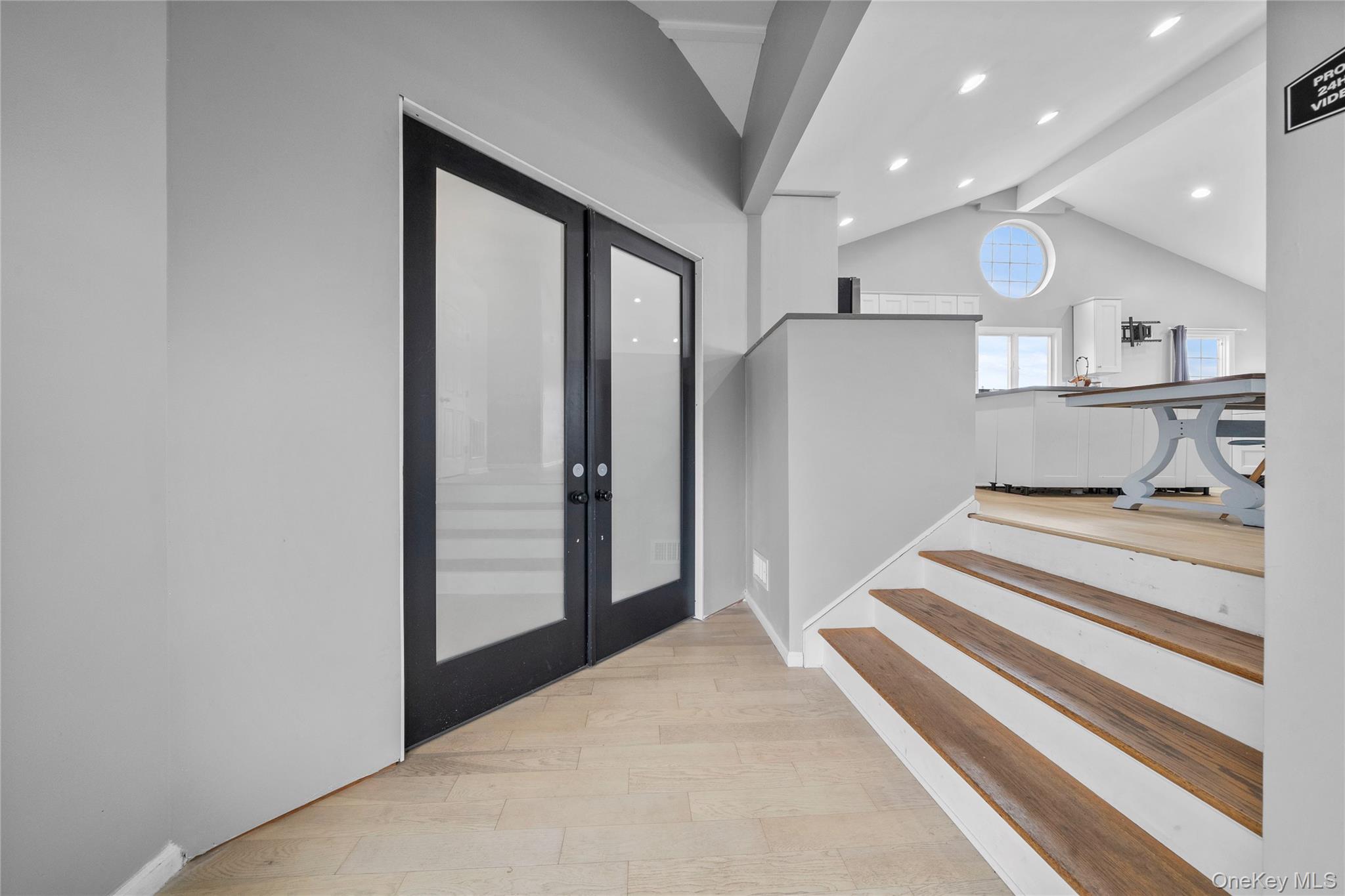 Undisclosed Address Freeport, NY 11520 - Photo 2 of 22 a view of a hallway with mirror and a ceiling fan