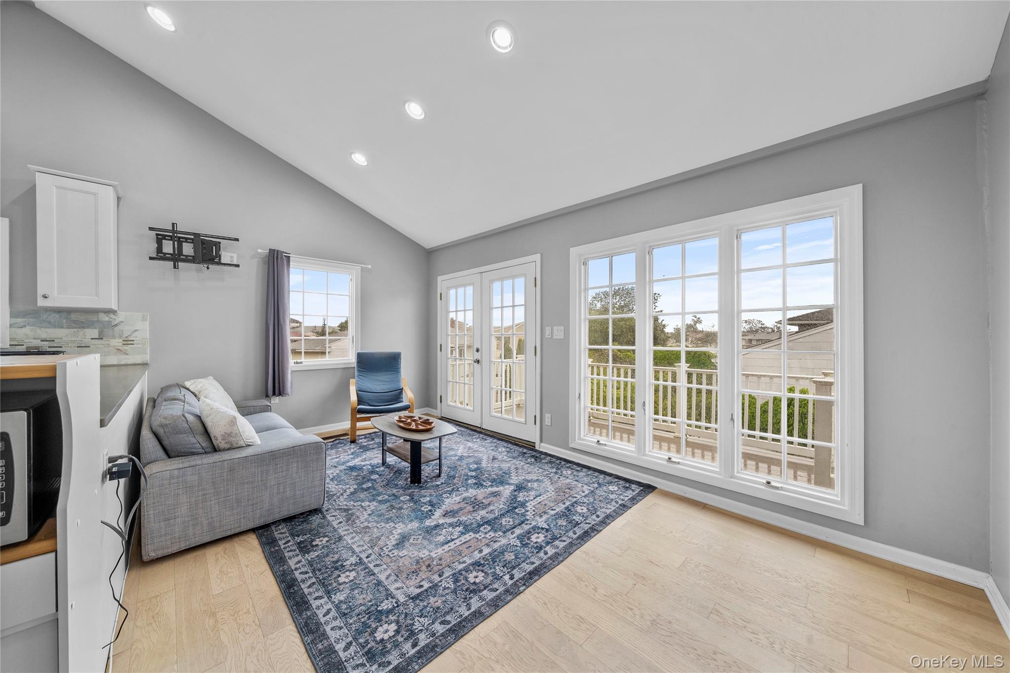 Undisclosed Address Freeport, NY 11520 - Photo 5 of 22 a living room with furniture and a large window