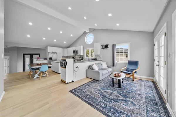 a living room with furniture and a table