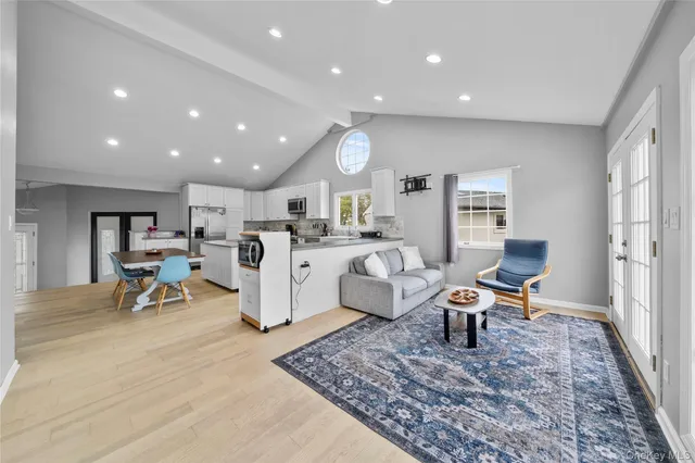 a living room with furniture and a table