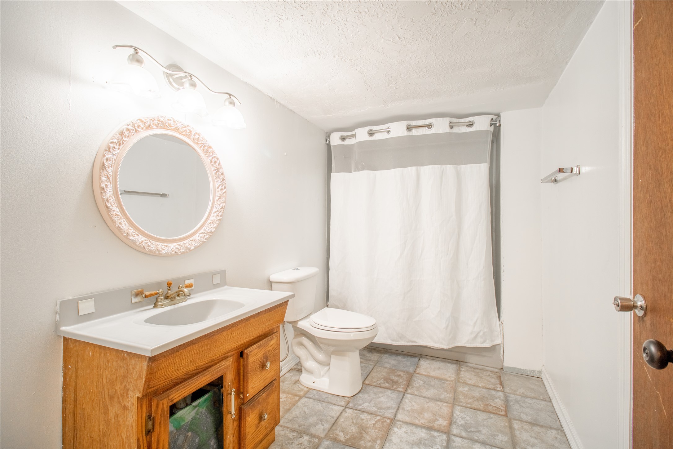 27607 Decker Woods Drive Magnolia, TX 77354 - Photo 11 of 48 a bathroom with a sink a toilet and a mirror
