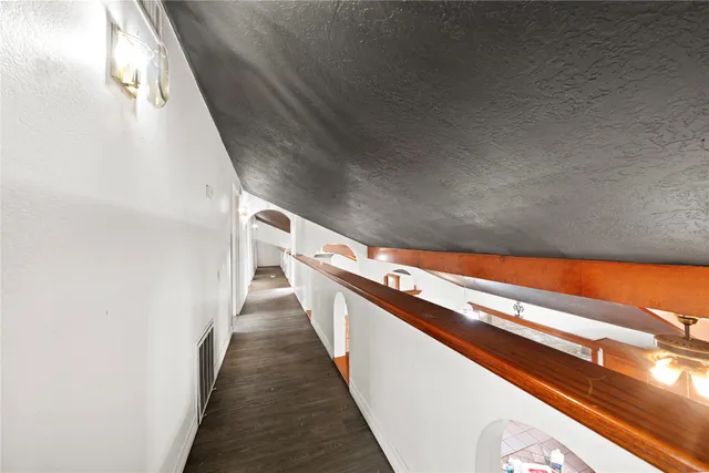 a bathroom with a sink a toilet a mirror and shower