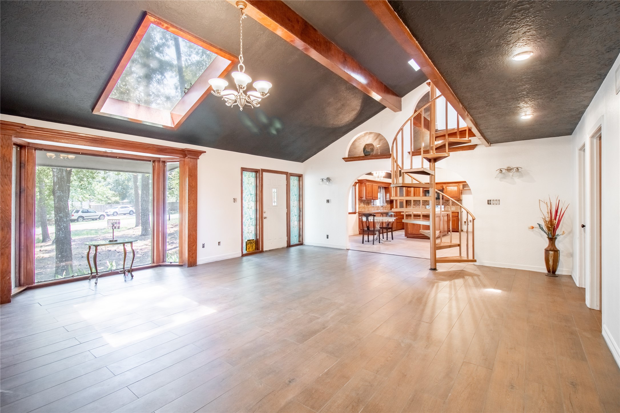 27607 Decker Woods Drive Magnolia, TX 77354 - Photo 2 of 48 a view of an empty room with windows and furniture