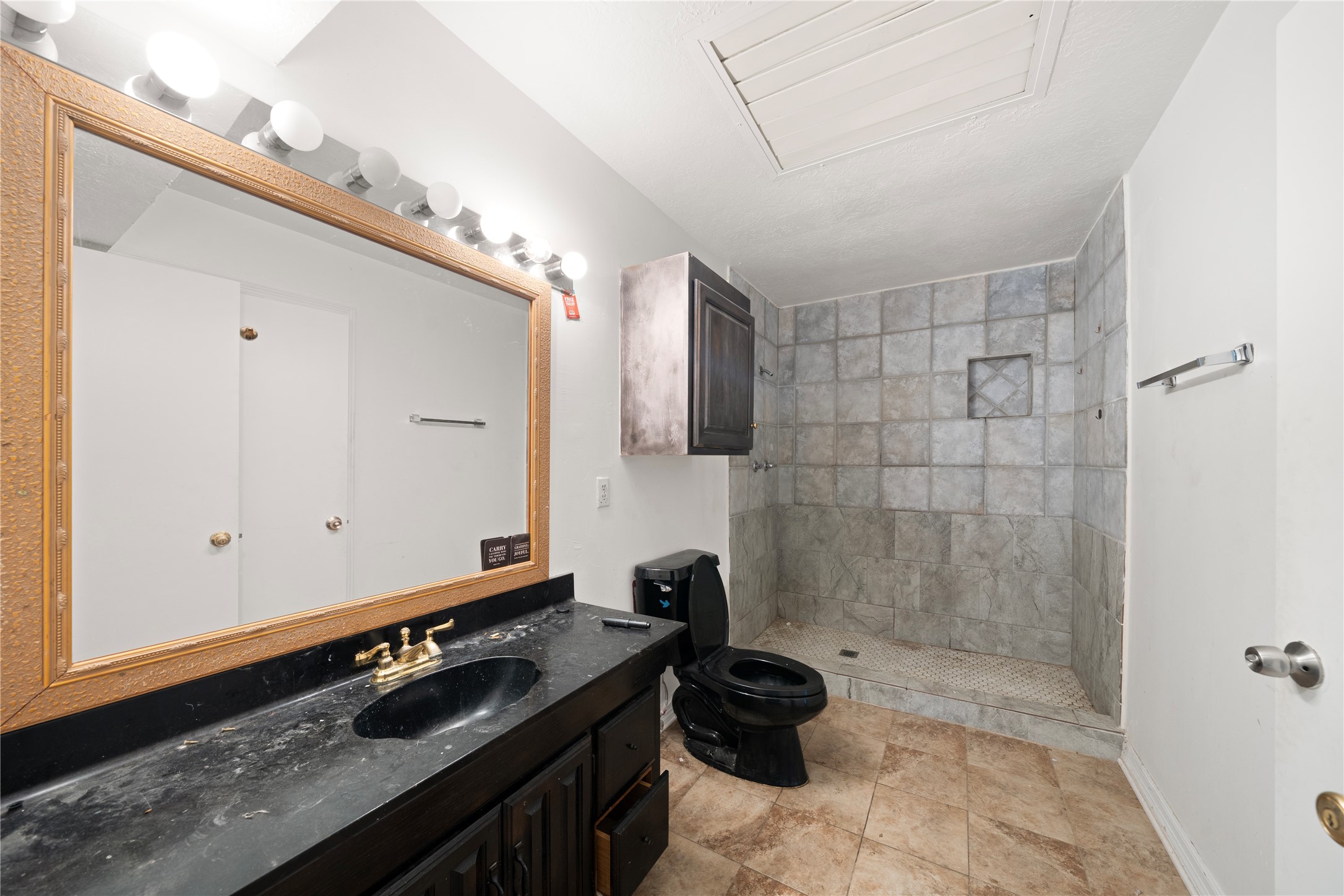 27607 Decker Woods Drive Magnolia, TX 77354 - Photo 23 of 48 a bathroom with a sink a toilet a mirror and shower