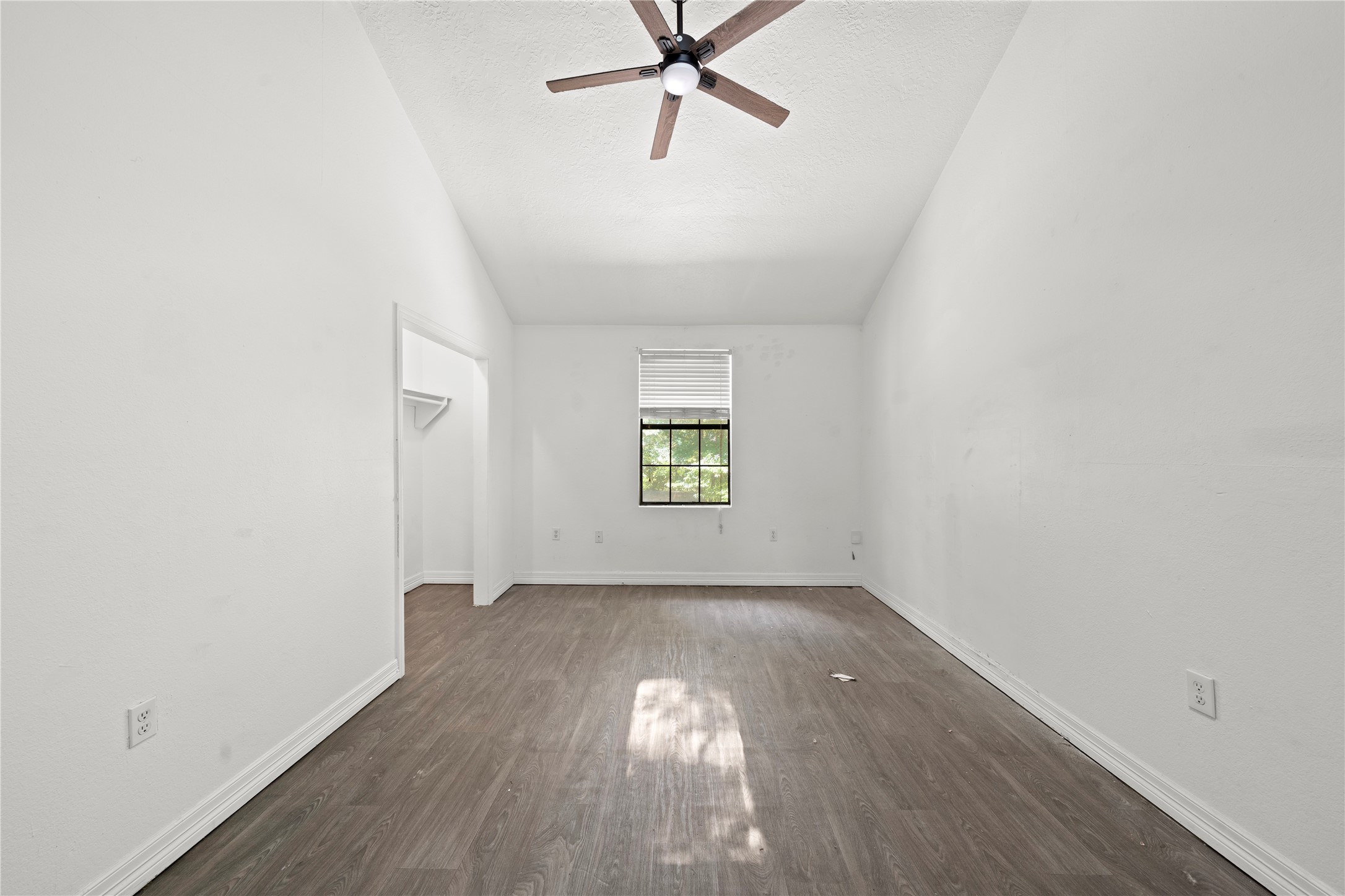 27607 Decker Woods Drive Magnolia, TX 77354 - Photo 27 of 48 wooden floor in an empty room with a window