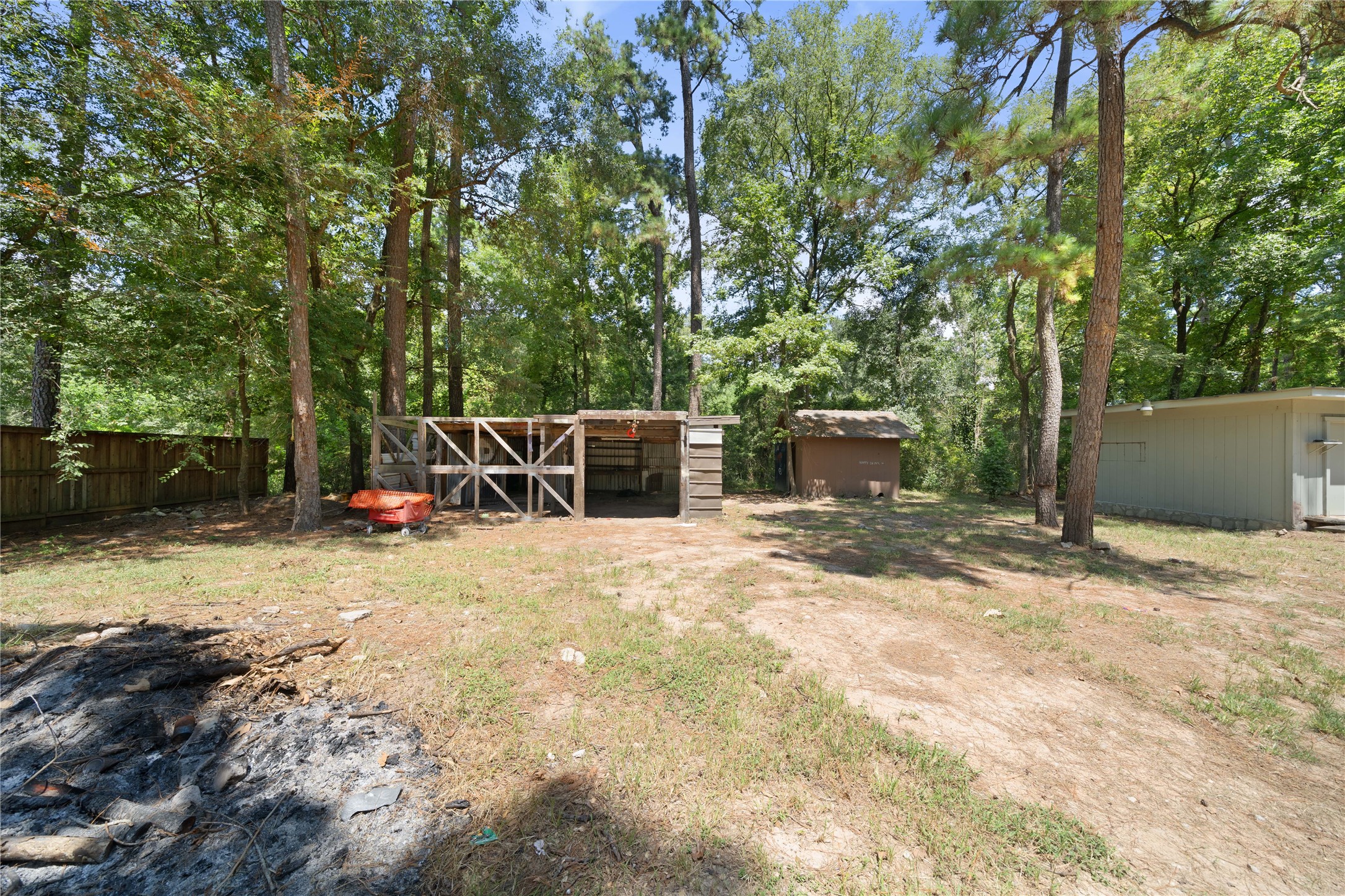 27607 Decker Woods Drive Magnolia, TX 77354 - Photo 40 of 48 a view of a backyard with basketball court